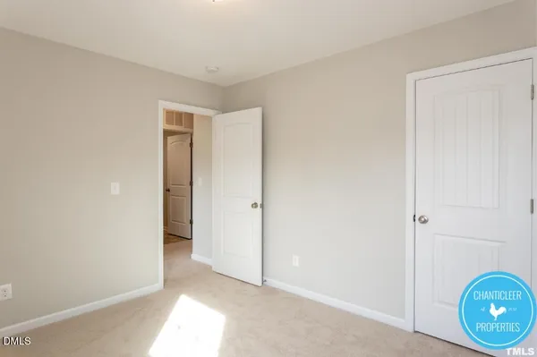 a view of an empty room and wooden floor