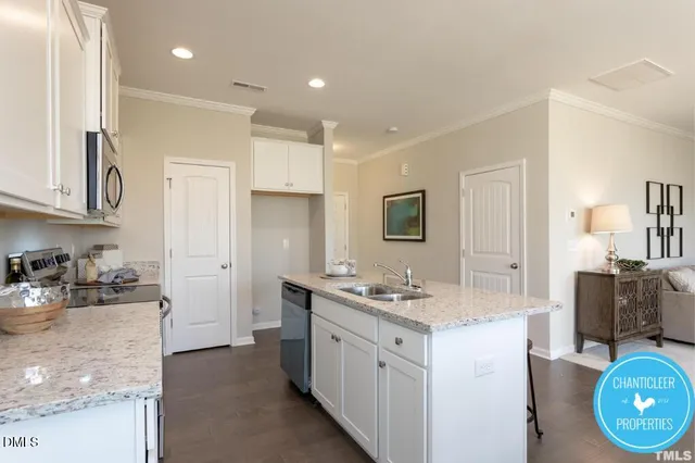 a kitchen with a sink stove and refrigerator