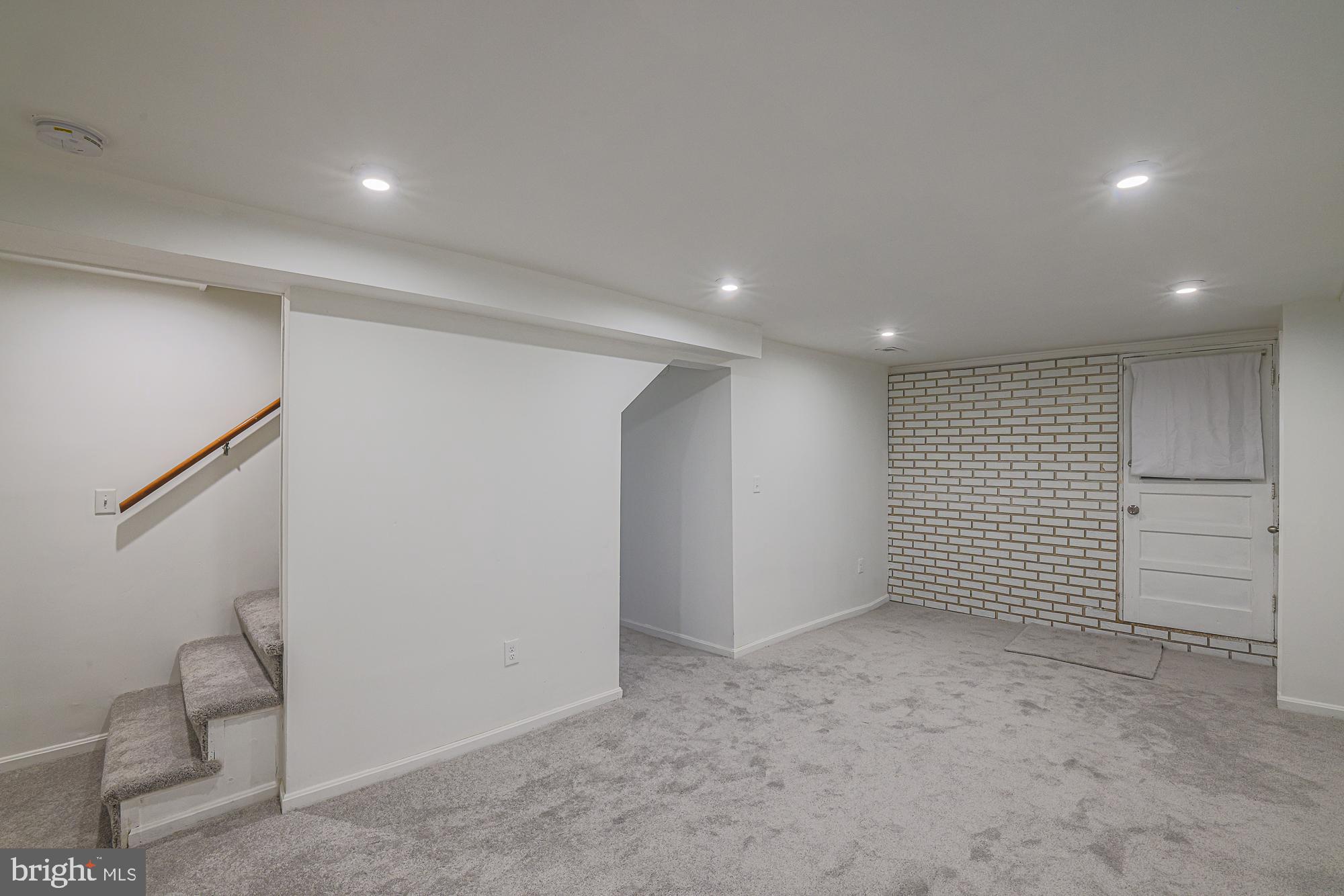 410 Kingston Road Baltimore, MD 21229 - Photo 37 of 56 Recessed lights, new paint + carpet for family rm