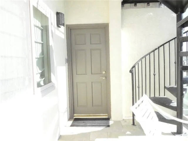 a view of a bedroom from a hallway