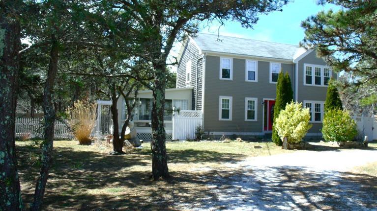 72 Shore Road Truro, MA 02666 - Photo 3 of 15 a front view of a house with a yard