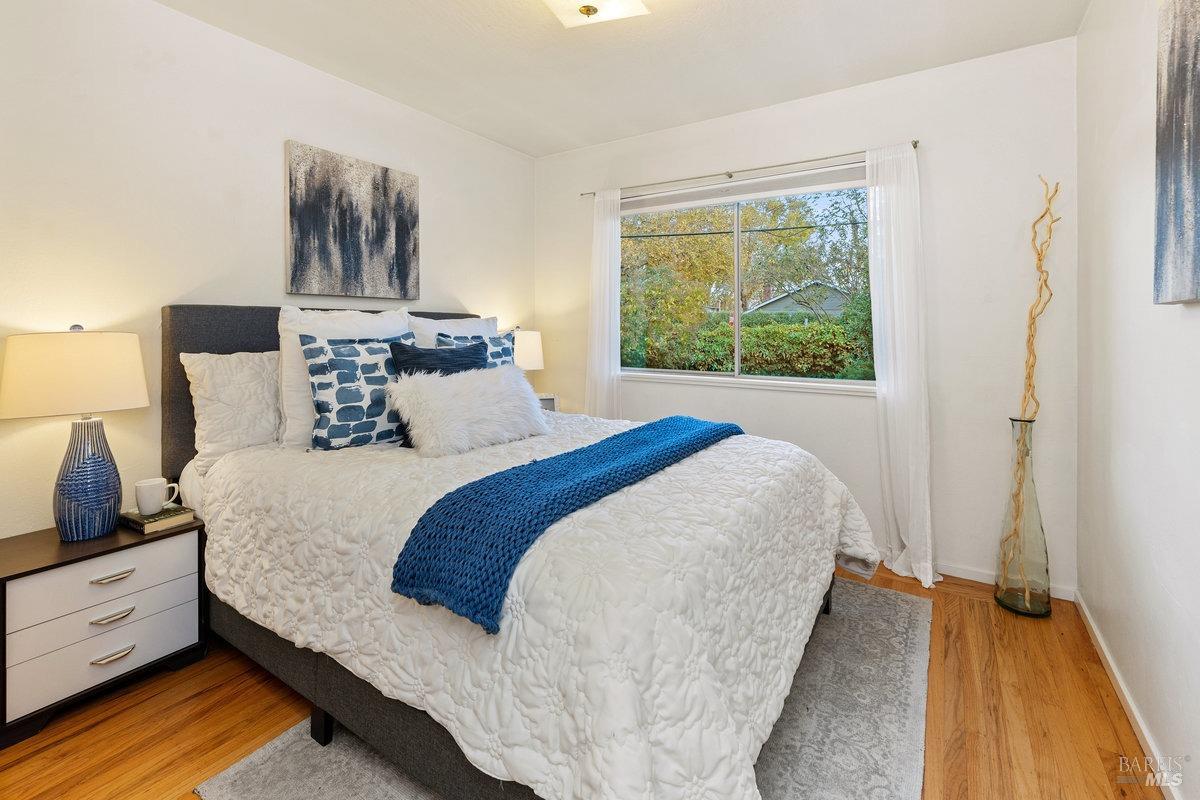 29 Locust Avenue Mill Valley, CA 94941 - Photo 11 of 26 a bed sitting in a bedroom next to a window