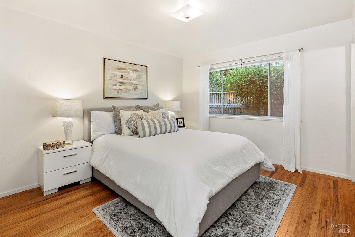 29 Locust Avenue Mill Valley, CA 94941 - Photo 12 of 26 a bed room with a bed and a night stand