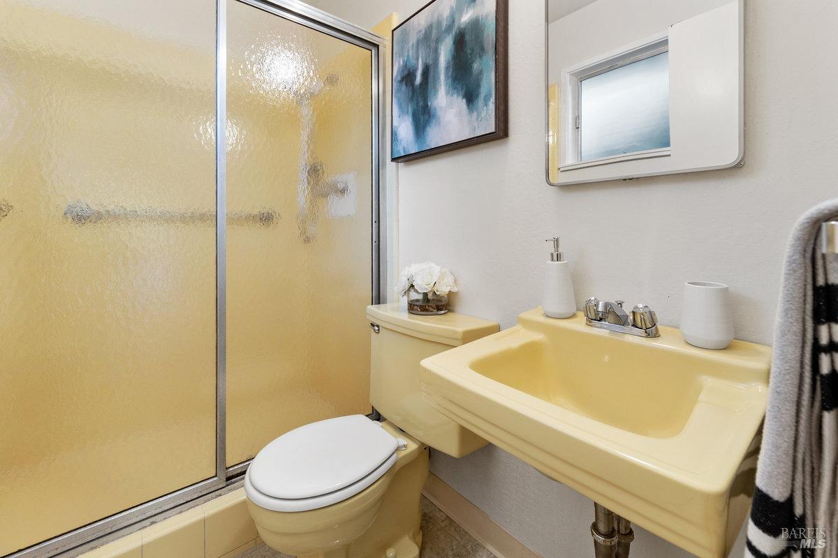 29 Locust Avenue Mill Valley, CA 94941 - Photo 15 of 26 a bathroom with a sink and a toilet
