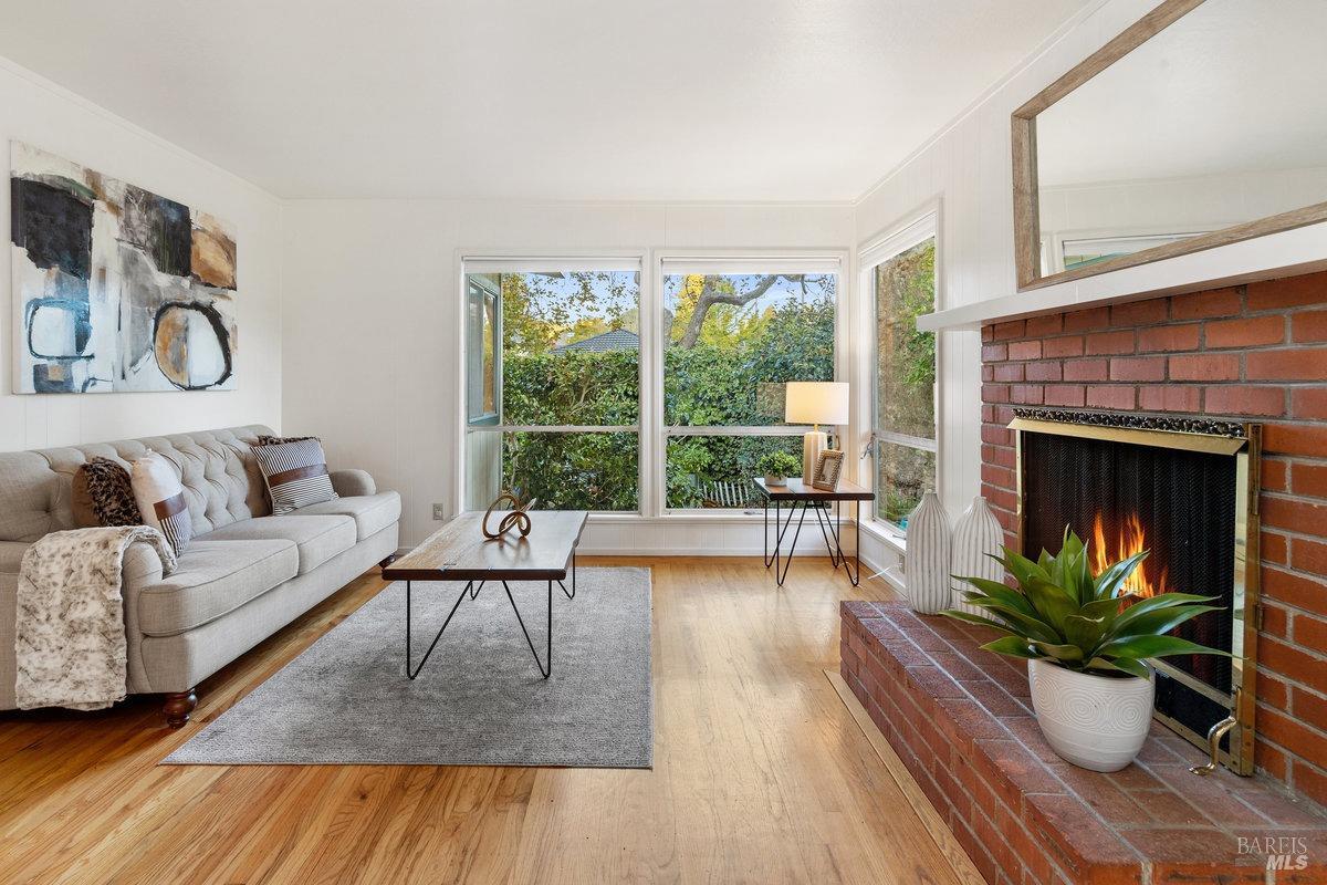 29 Locust Avenue Mill Valley, CA 94941 - Photo 2 of 26 a living room with furniture and a fireplace