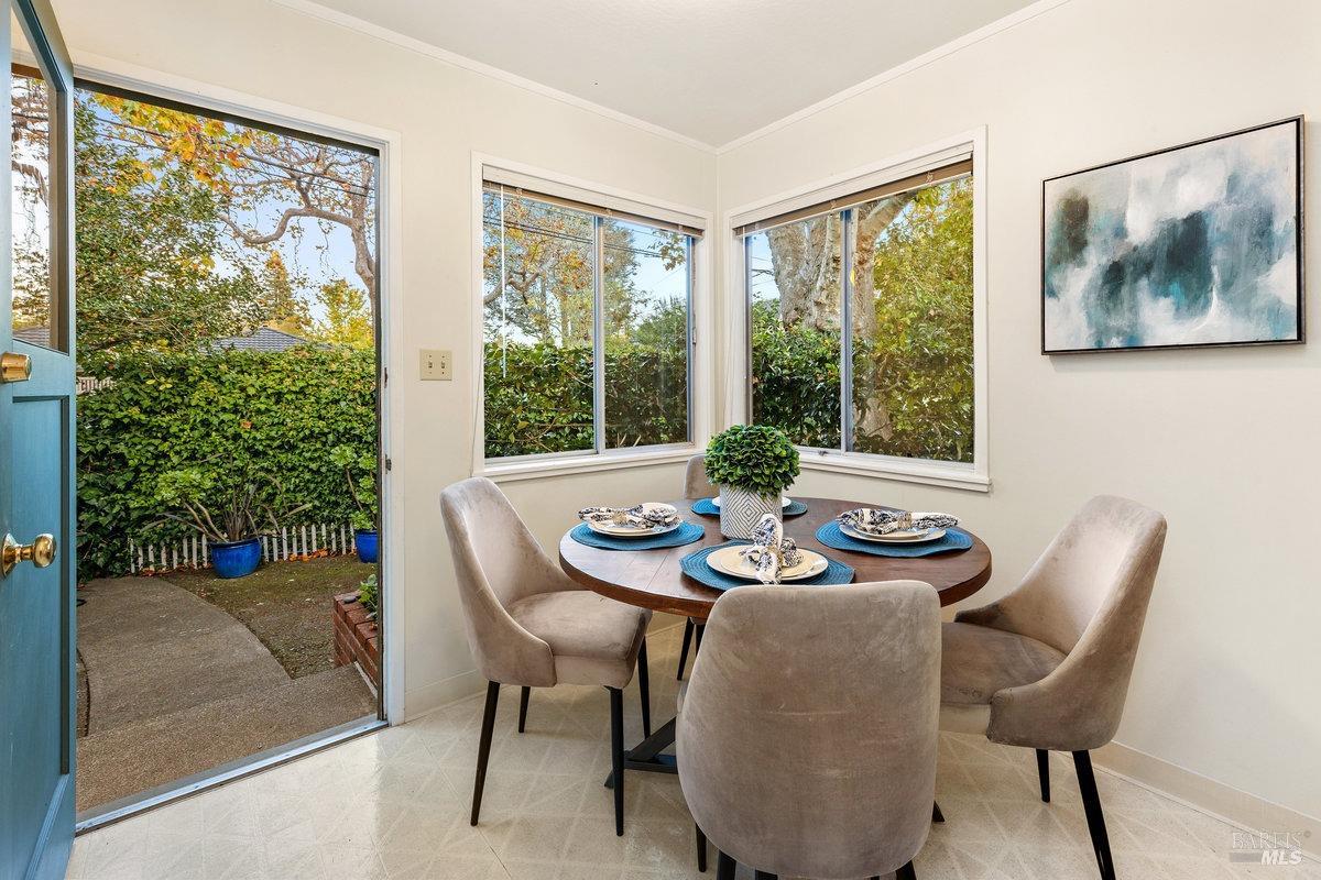 29 Locust Avenue Mill Valley, CA 94941 - Photo 6 of 26 a view of a dining room with furniture large windows and wooden floor