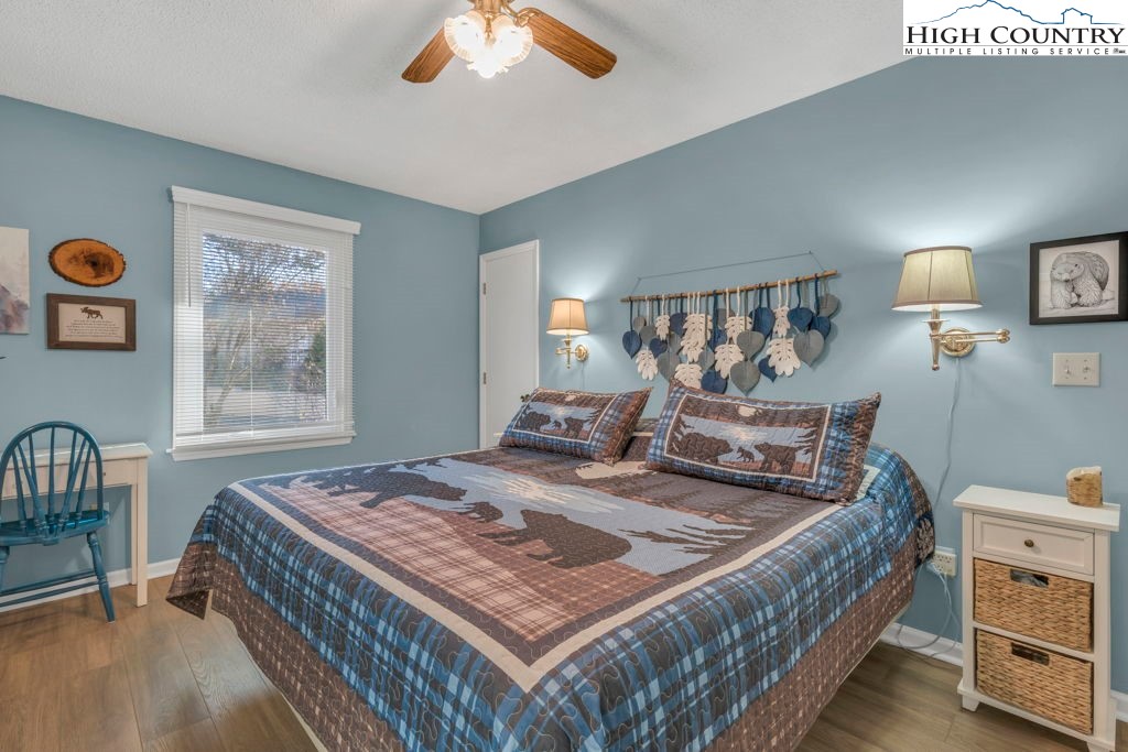 6 Ridgewood Lane Newland, NC 28657 - Photo 15 of 45 a bed sitting in a bedroom next to a window