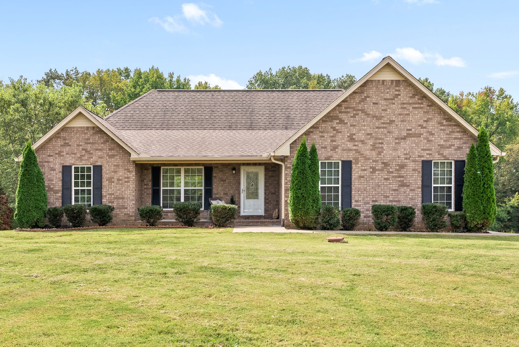 1105 Pleasant Valley Road Chapmansboro, TN 37035 - Photo 1 of 30 a front view of a house with a yard