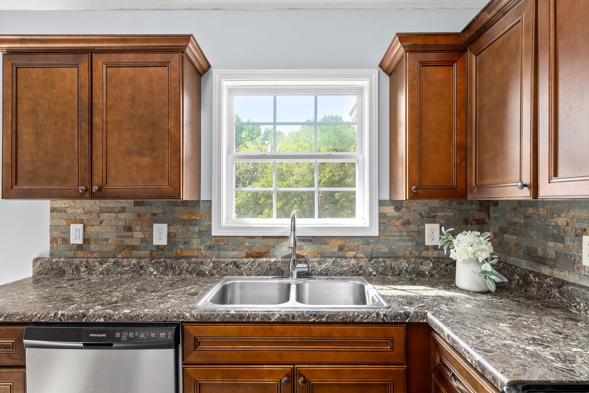 1105 Pleasant Valley Road Chapmansboro, TN 37035 - Photo 13 of 30 a kitchen with granite countertop sink and cabinets