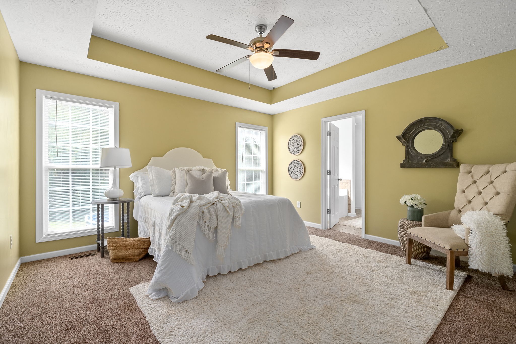 1105 Pleasant Valley Road Chapmansboro, TN 37035 - Photo 15 of 30 a spacious bedroom with a bed and a chandelier