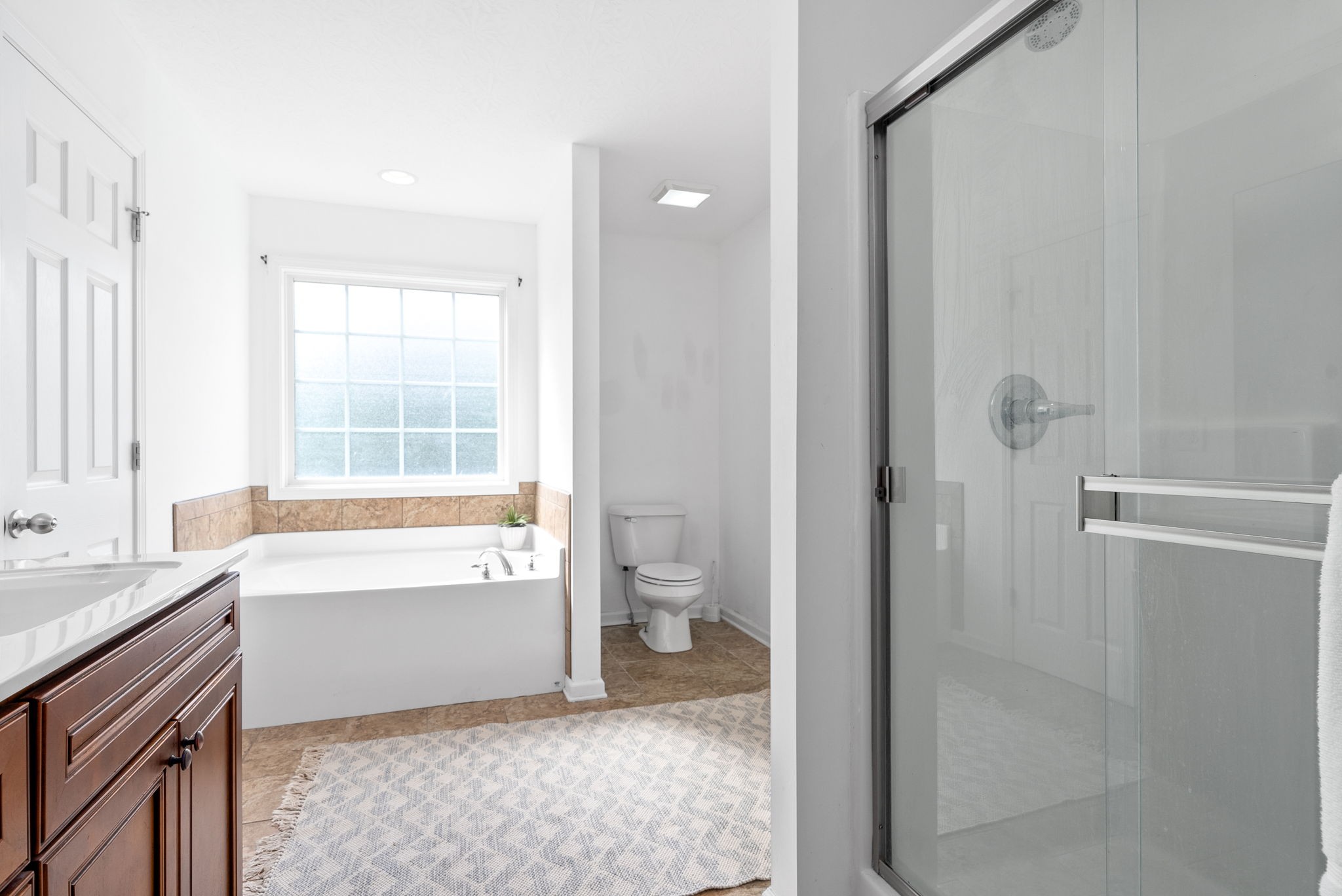 1105 Pleasant Valley Road Chapmansboro, TN 37035 - Photo 17 of 30 a bathroom with a granite countertop bathtub shower and toilet