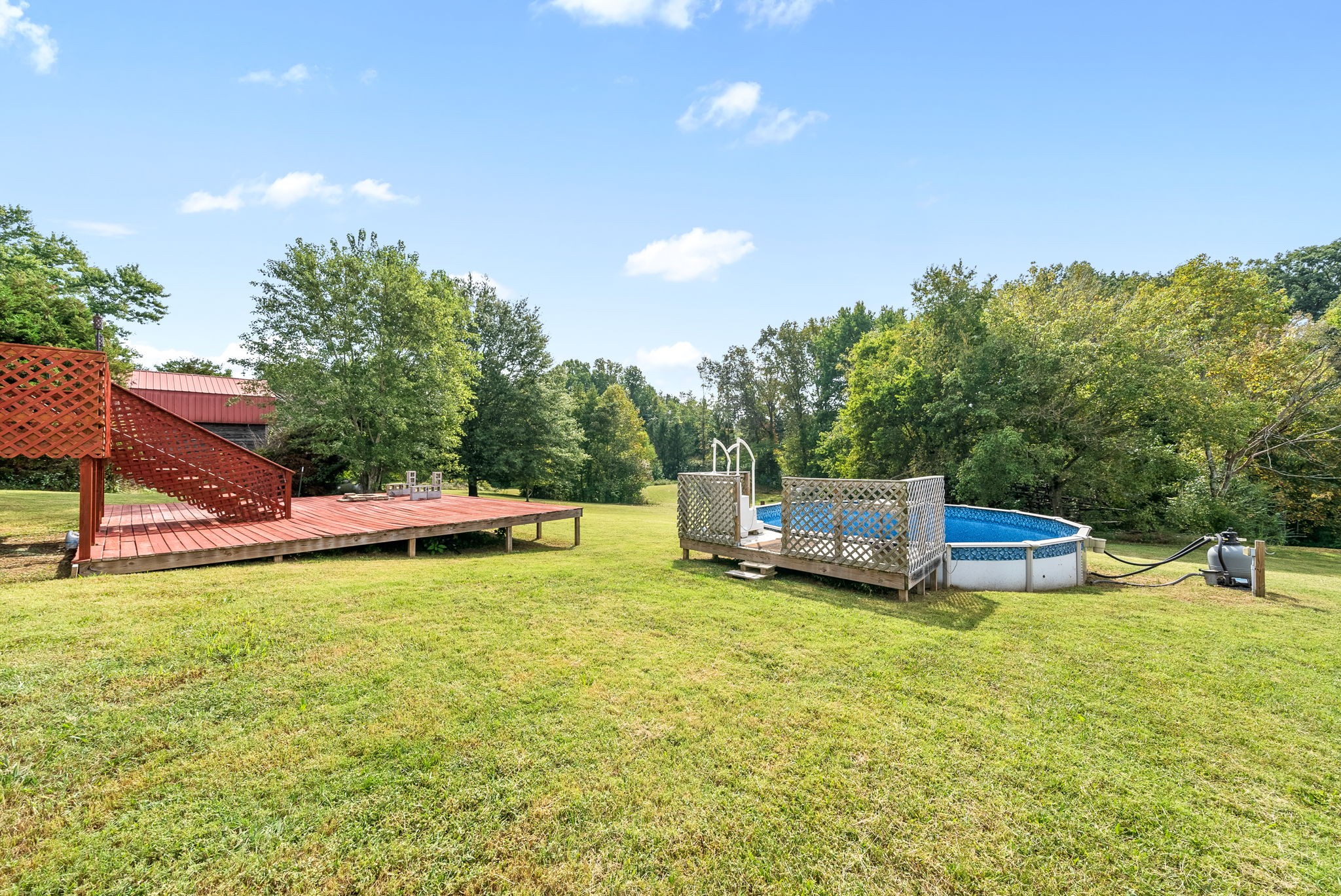 1105 Pleasant Valley Road Chapmansboro, TN 37035 - Photo 27 of 30 a view of a swimming pool with a bench and trees