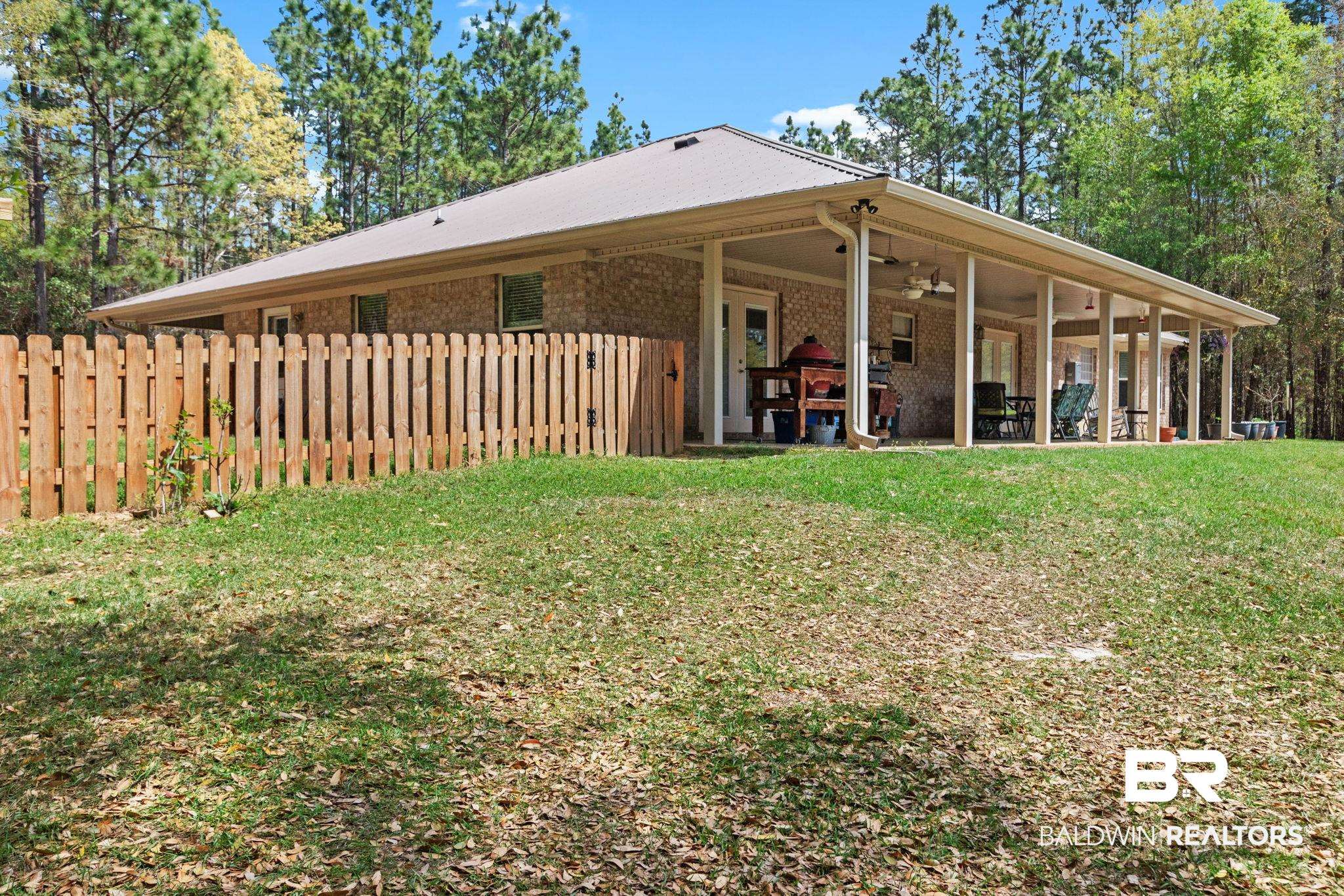 24250 Hack Road Bay Minette, AL 36507 - Photo 43 of 88 Rear view of house featuring ceiling fan and brick siding