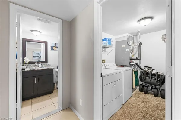 a en suite bathroom with a sink vanity and mirror