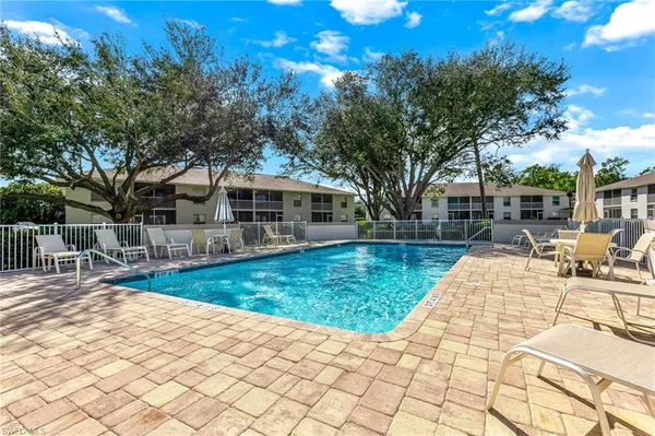a view of a swimming pool with a patio