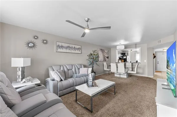 a living room with furniture and a table