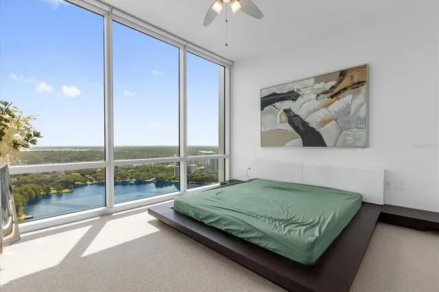 a bedroom with a bed and window