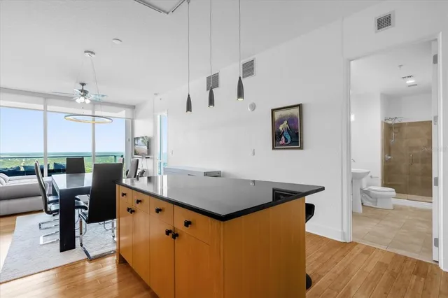 a view of kitchen with cabinets and wooden floor