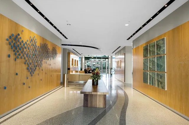 a view of a living room with a large window