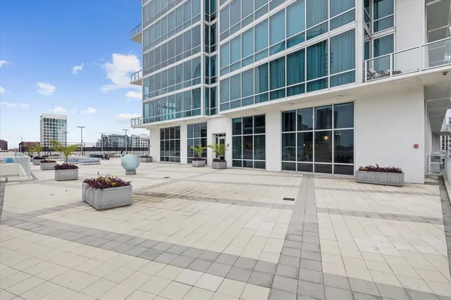 a view of a building with potted plants