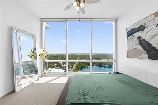 a living room with a large window and table