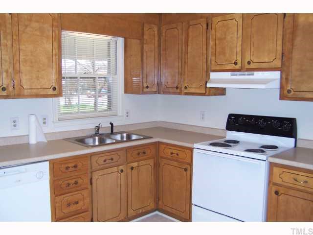 4905 Waterbury Road Raleigh, NC 27604 - Photo 3 of 12 a kitchen with a sink cabinets and window