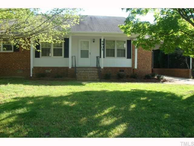 4905 Waterbury Road Raleigh, NC 27604 - Photo 10 of 12 a view of a yard in front of a house with green space