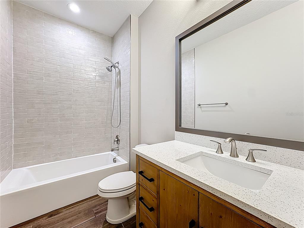 19424 Oakleaf Street Orlando, FL 32833 - Photo 17 of 43 a bathroom with a sink a toilet and shower