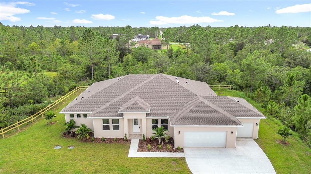 19424 Oakleaf Street Orlando, FL 32833 - Photo 3 of 43 an aerial view of a house with swimming pool and garden