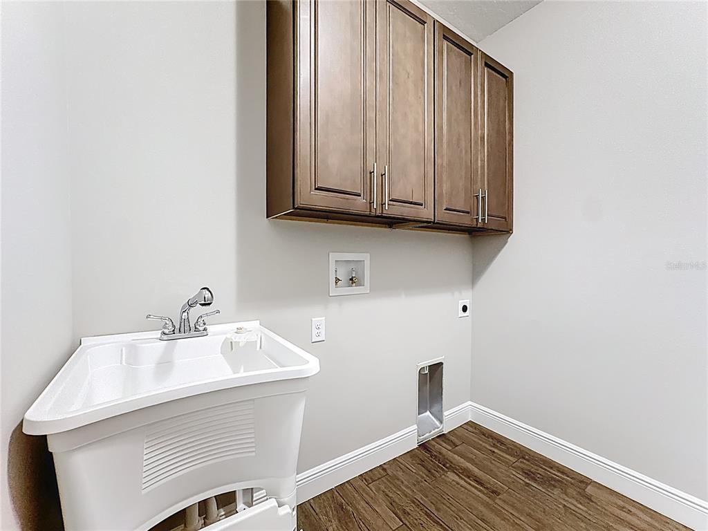 19424 Oakleaf Street Orlando, FL 32833 - Photo 35 of 43 a bathroom with a sink and a mirror