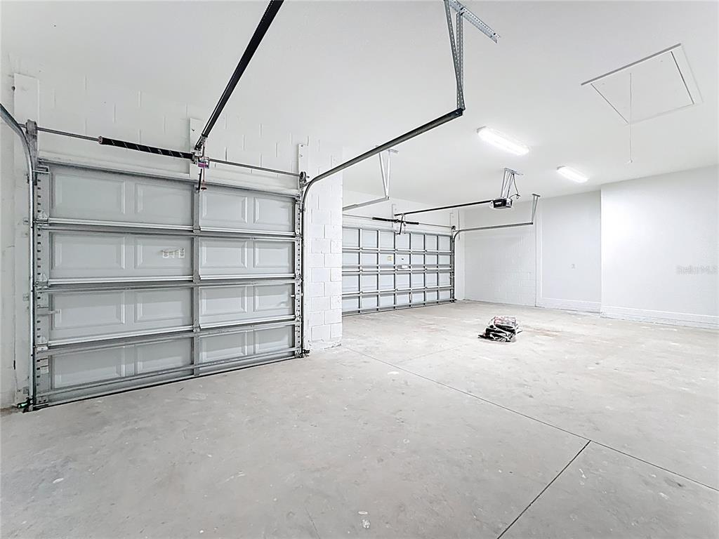 19424 Oakleaf Street Orlando, FL 32833 - Photo 38 of 43 a view of an empty room with a cabinet and mirrors