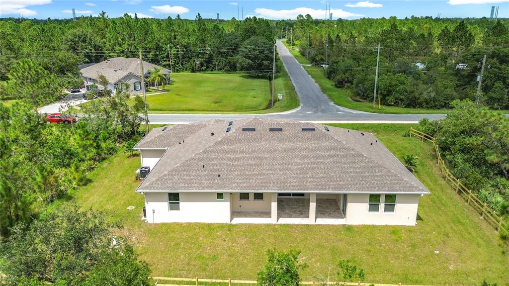 19424 Oakleaf Street Orlando, FL 32833 - Photo 42 of 43 a aerial view of a house with a yard and large trees