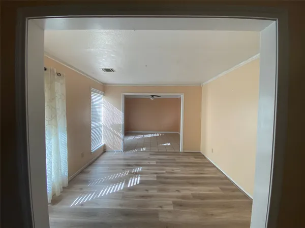 a view of a hallway with a bedroom