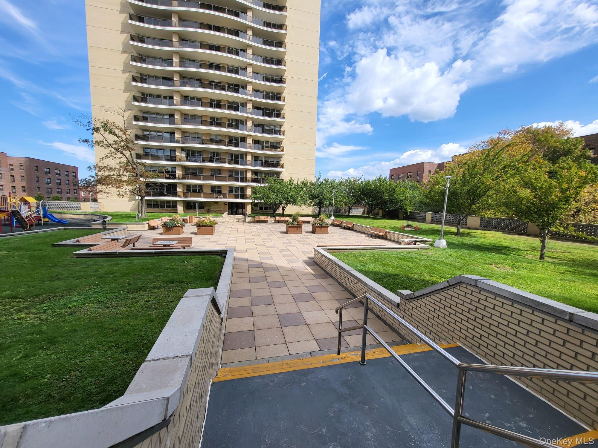 102-10 66th Road, Unit 25A Queens, NY 11375 - Photo 16 of 20 a view of a patio with a garden