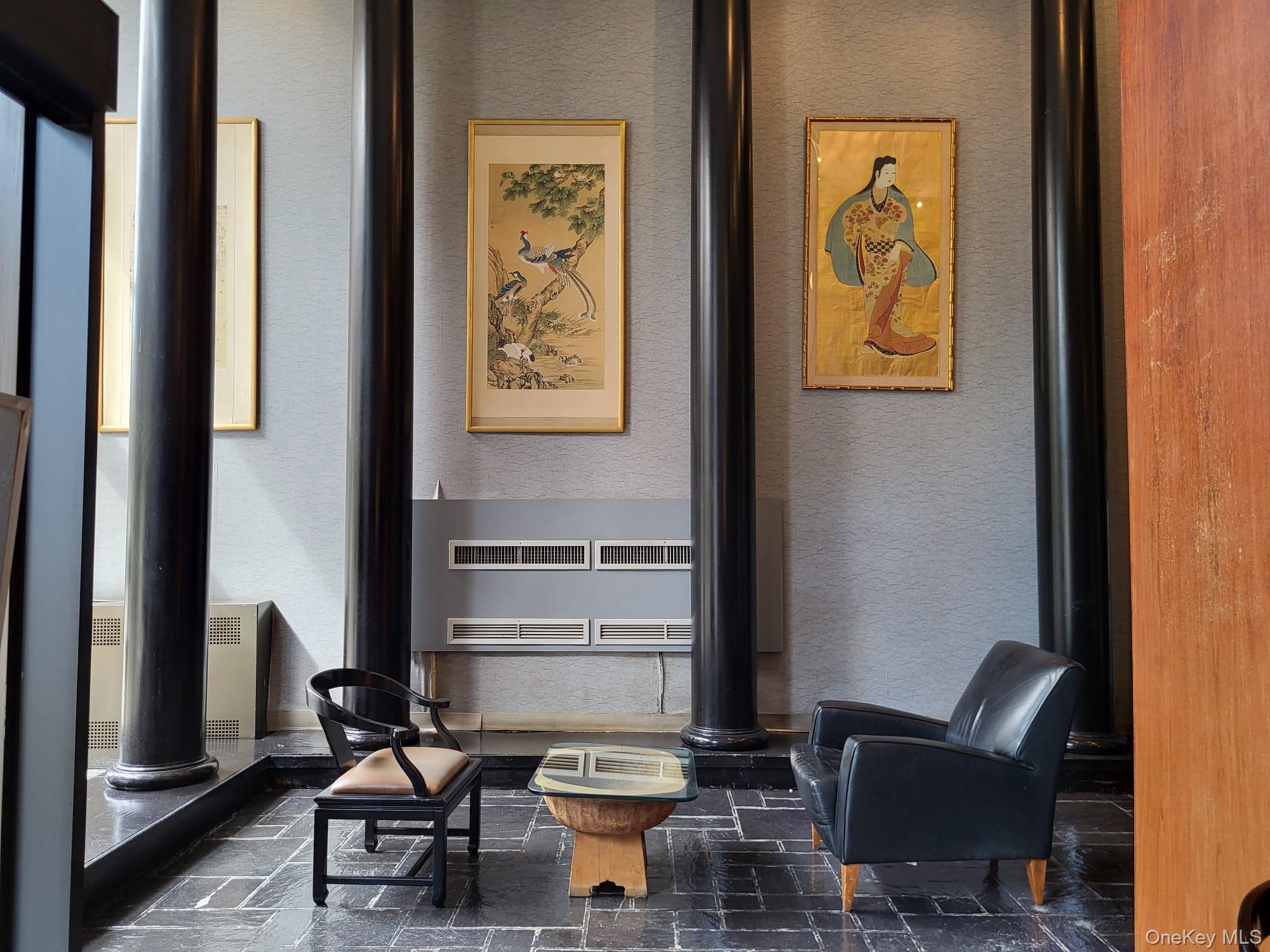 102-10 66th Road, Unit 25A Queens, NY 11375 - Photo 4 of 20 a living room with furniture and a painting on the wall