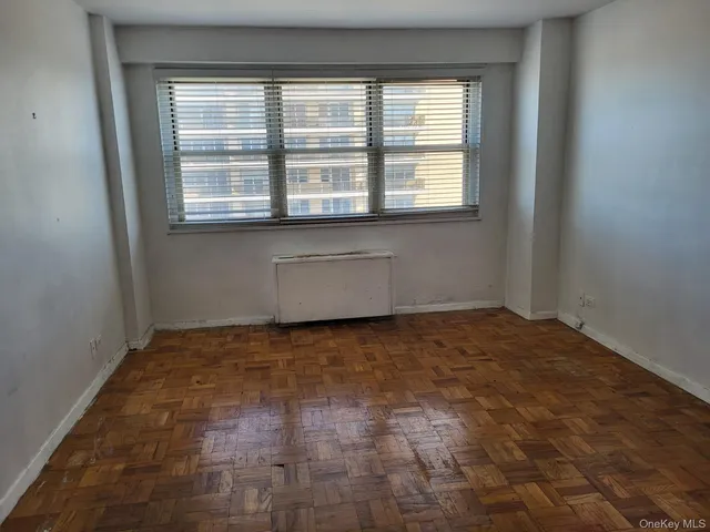a view of an empty room with a window