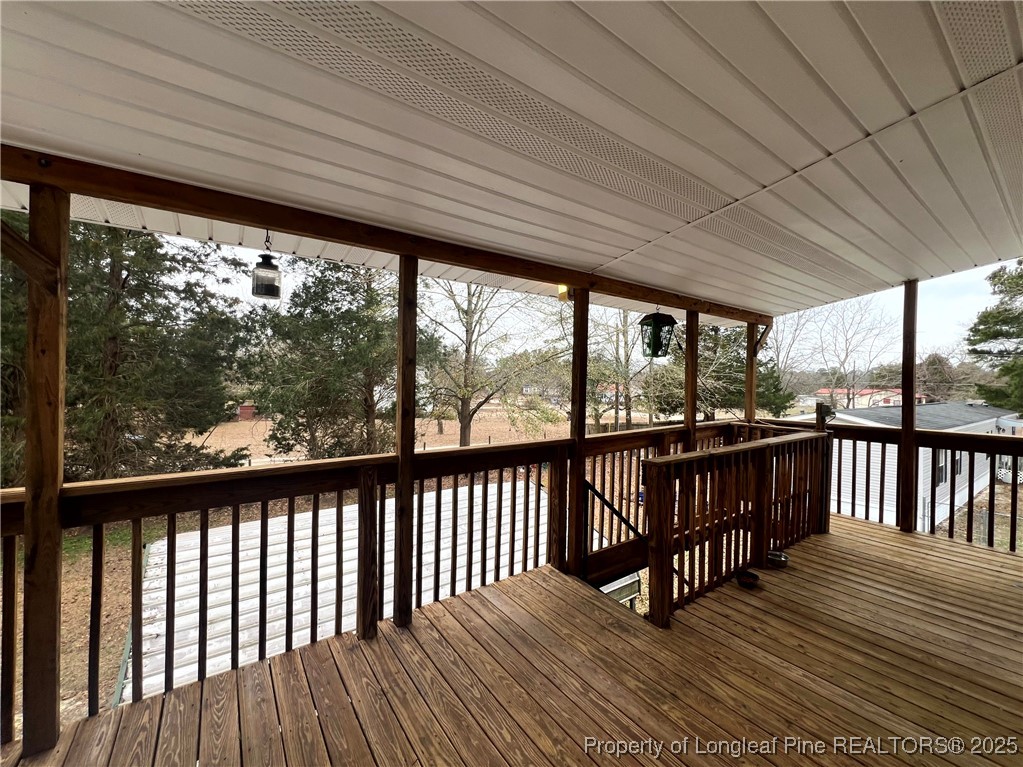 a view of balcony with wooden floor