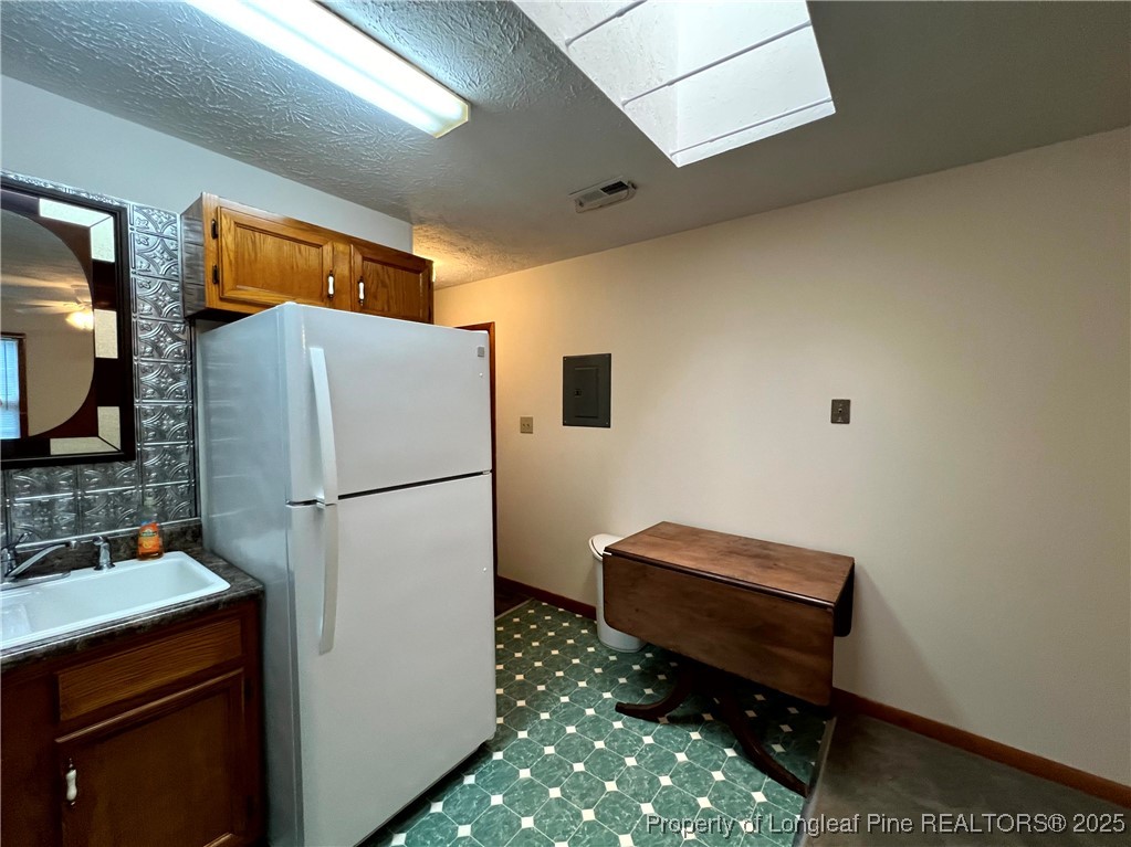 2472-2 John Hall Road Fayetteville, NC 28312 - Photo 6 of 10 a refrigerator freezer sitting in a kitchen with a refrigerator