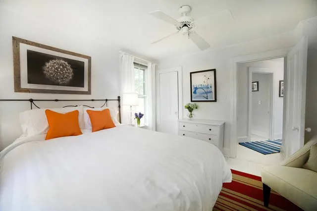 a bedroom with a bed and a couch