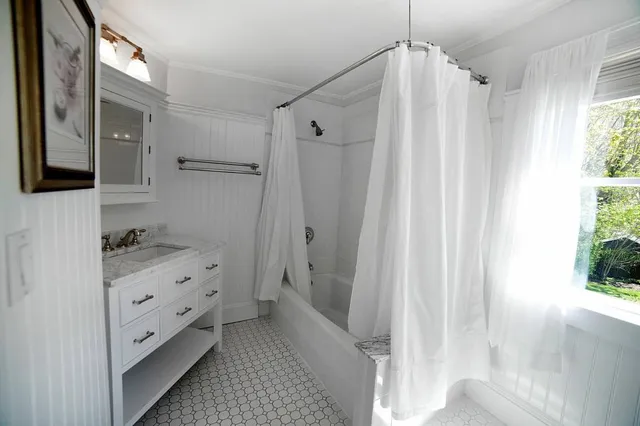 a bathroom with a shower and a tub