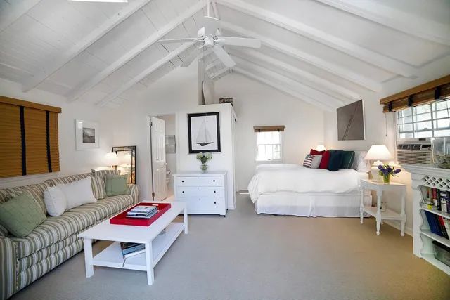 a bedroom with furniture and a bed