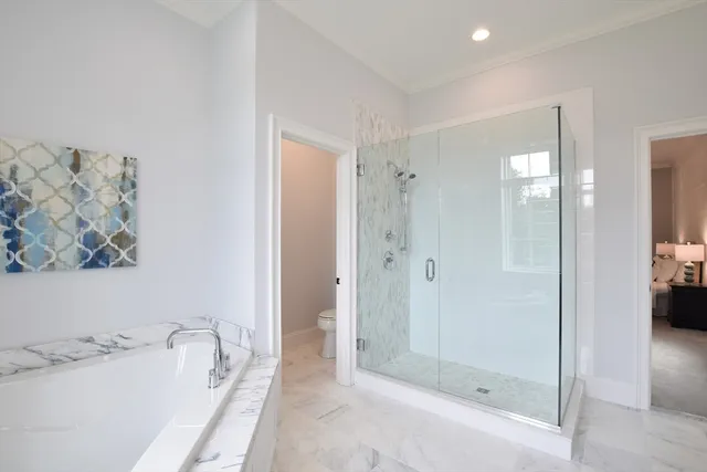 a bathroom with a tub sink and shower