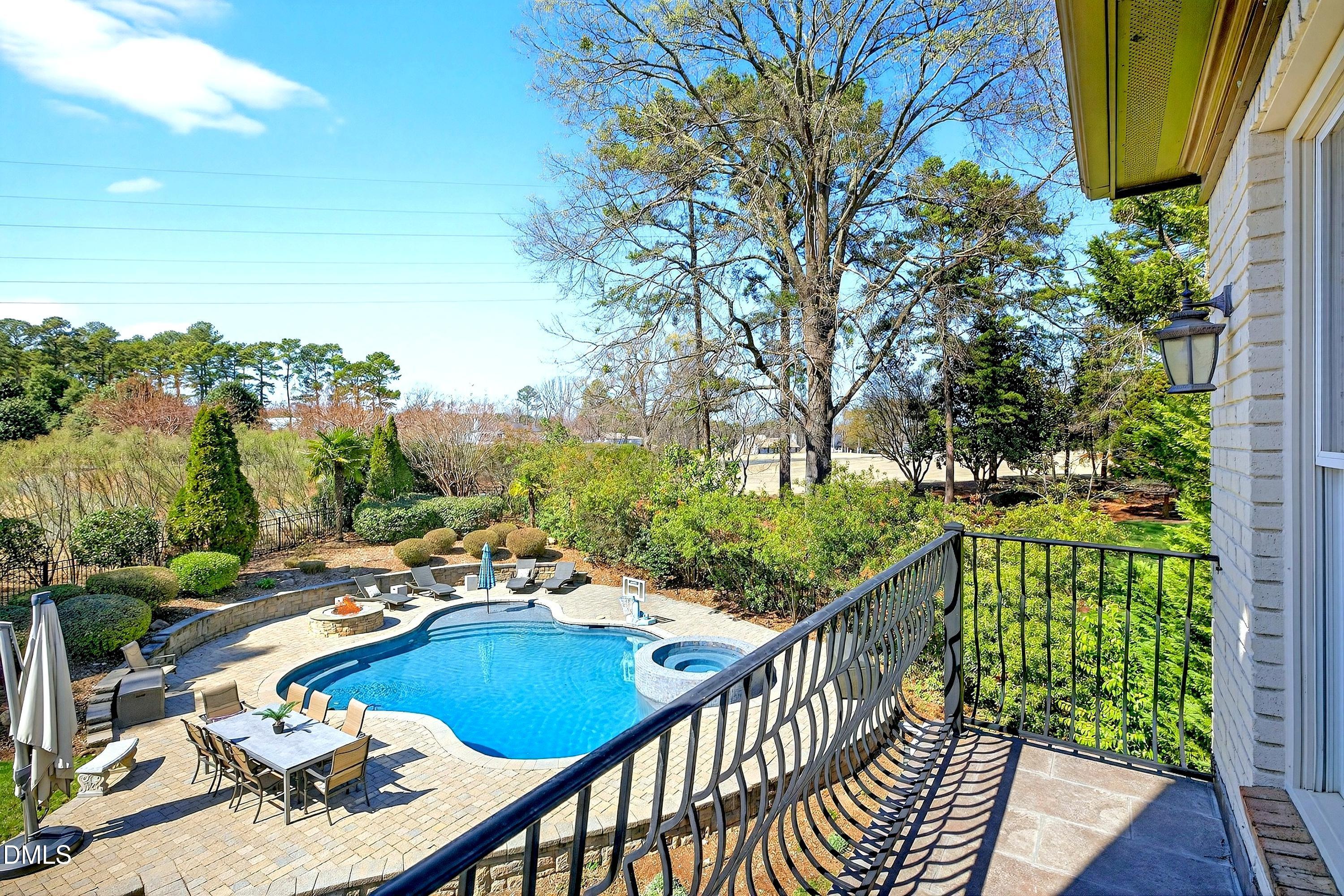 6701 Foxfire Place Raleigh, NC 27615 - Photo 37 of 67 a balcony with wooden floor and outdoor seating