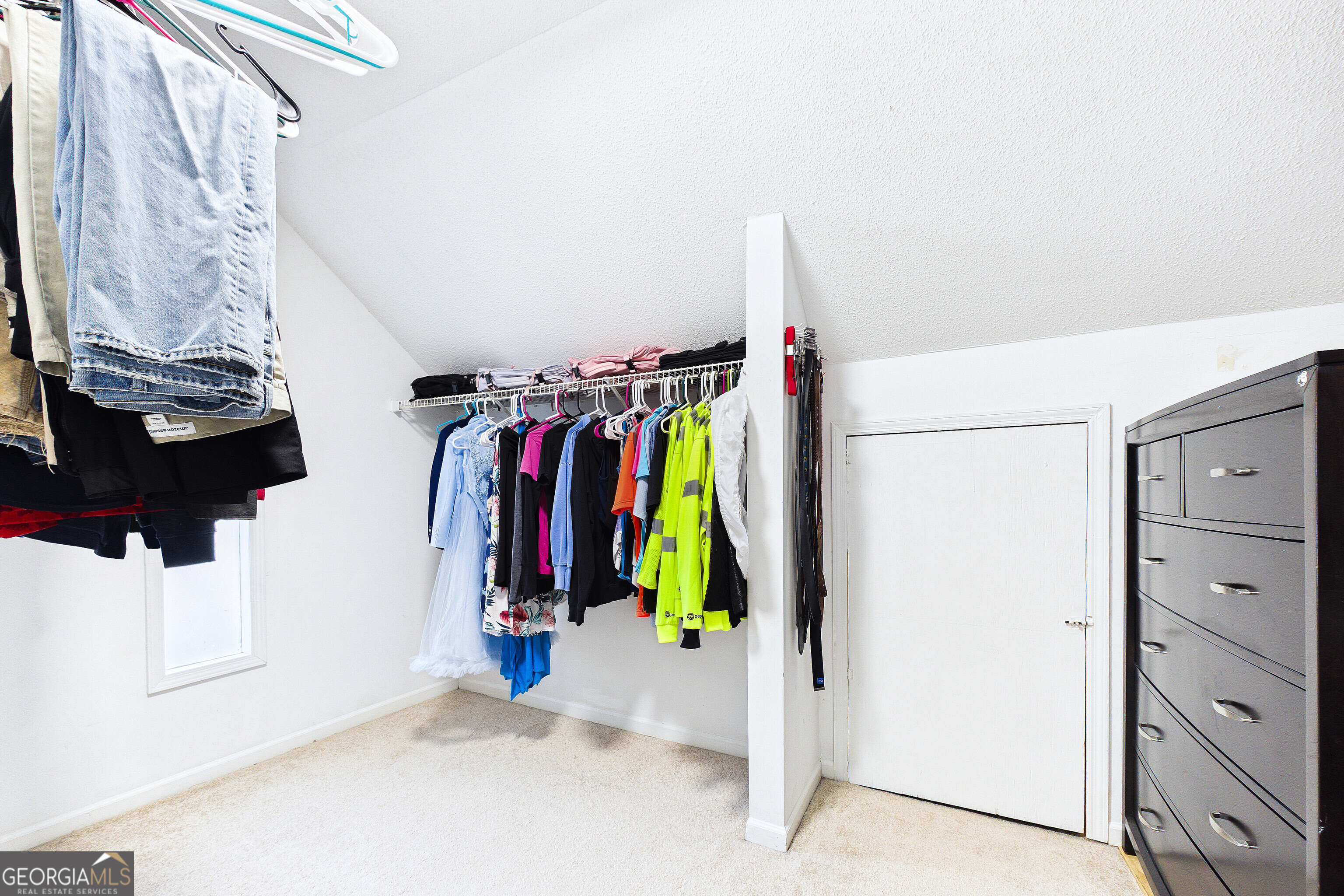 285 Edgewater Drive Macon, GA 31220 - Photo 44 of 66 a view of walk in closet with clothes