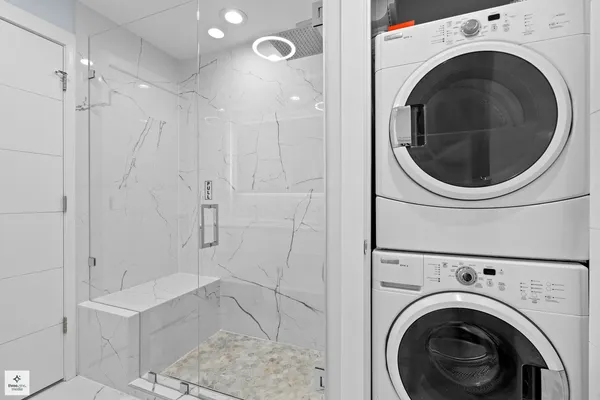 a bathroom with a bathtub and a shower