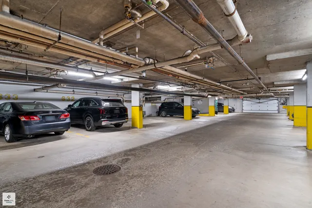 a view of parking garage with cars