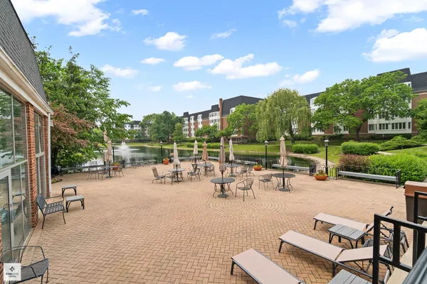 a view of a patio with a table and chairs