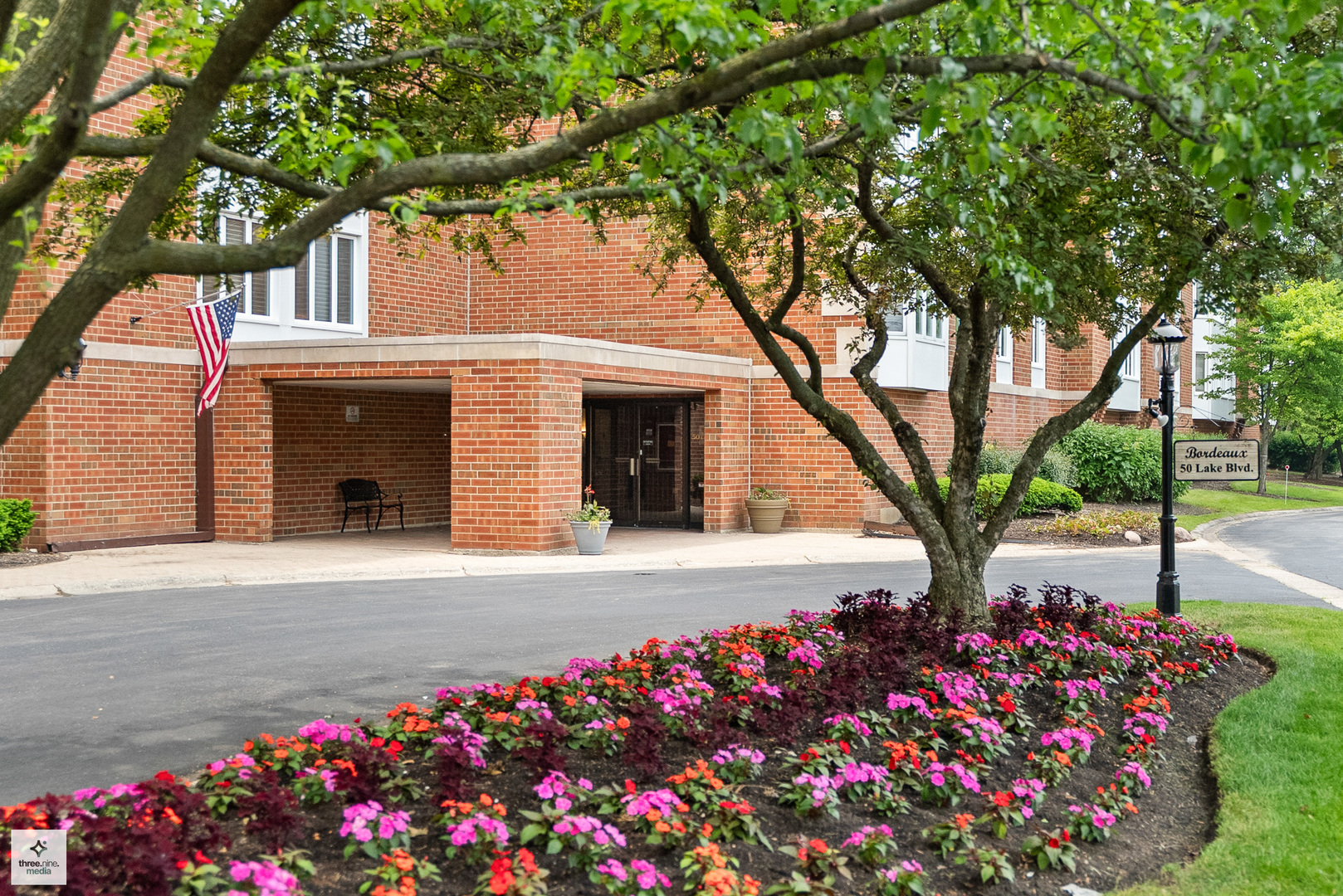 50 Lake Boulevard, Unit 632 Buffalo Grove, IL 60089 - Photo 2 of 26 a front view of a house with a yard and fountain