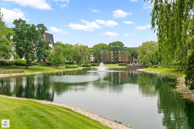 a view of a lake with a house in the background