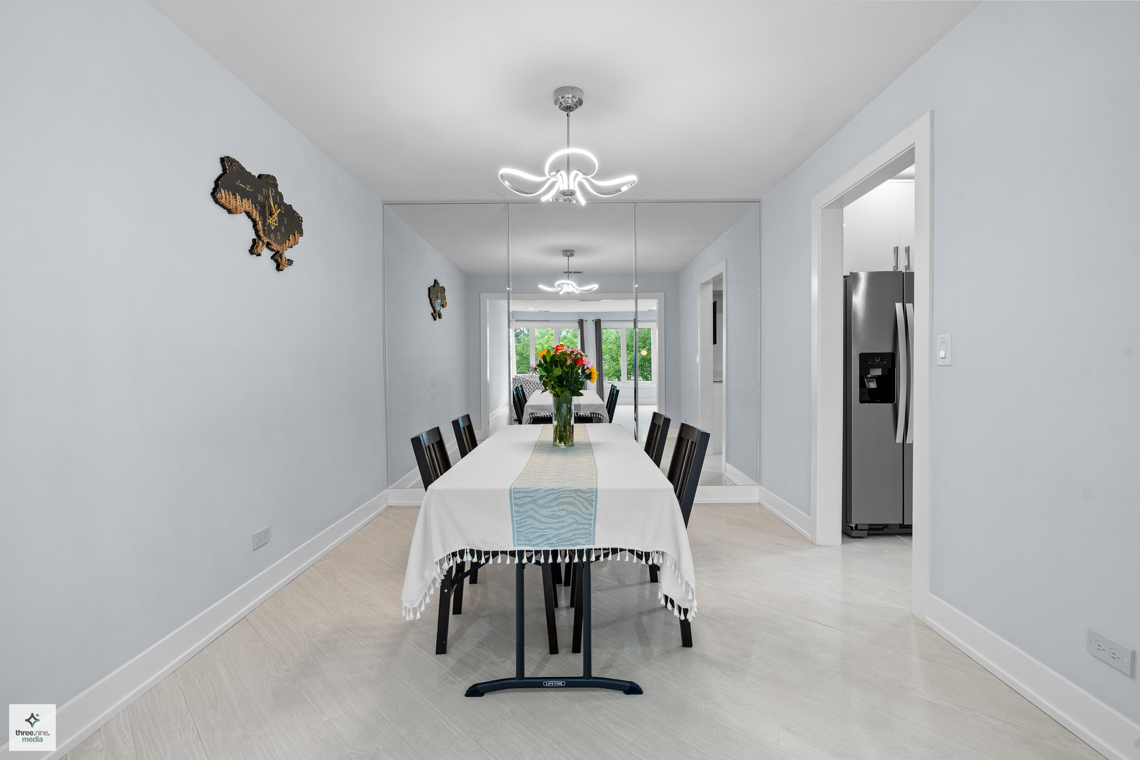 50 Lake Boulevard, Unit 632 Buffalo Grove, IL 60089 - Photo 7 of 26 a view of a dining room with furniture and a chandelier